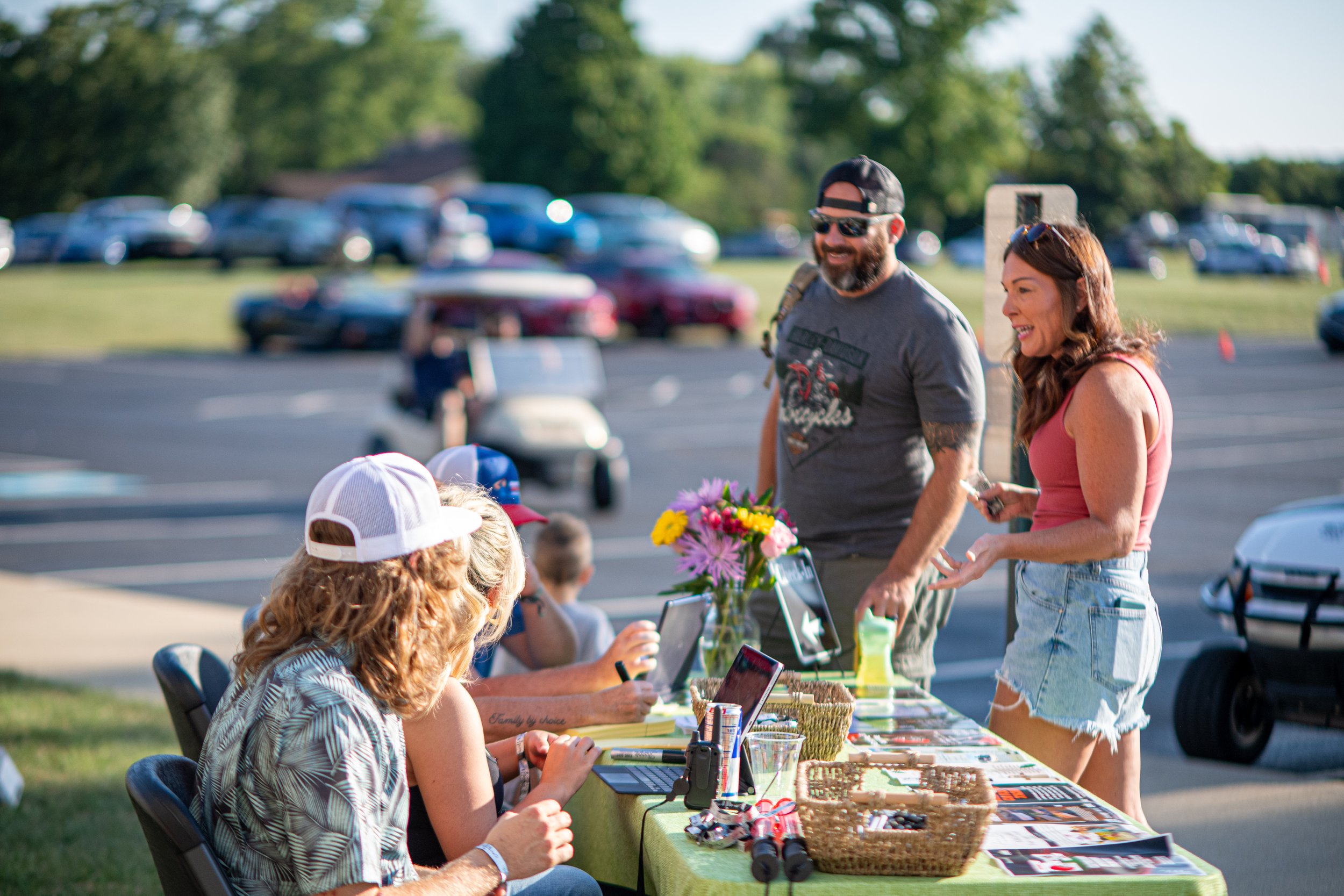 Guests enjoying an outdoor community event at Sparks of Giving