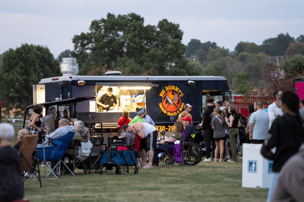 Guests lined up at the Big Rummy's smoked snacks food truck at Sparks of Giving
